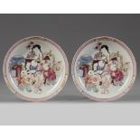 A pair of Chinese ruby-back famille rose 'lady and boys' dishes