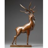 A bronze figure of a deer