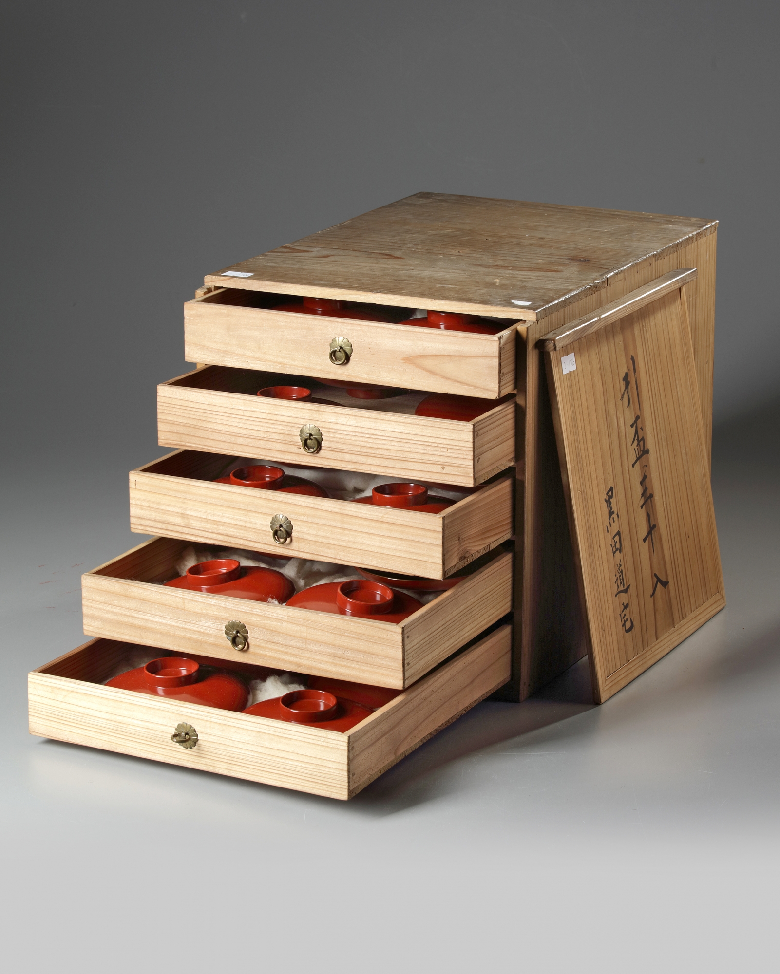 A thirty-piece red lacquered sake set