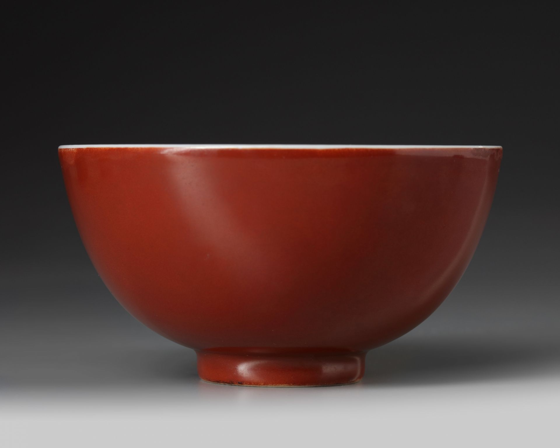 A Chinese coral-red-ground blue and white bowl