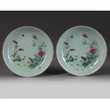 A pair of Chinese celadon-ground famille rose ‘quail’ dishes