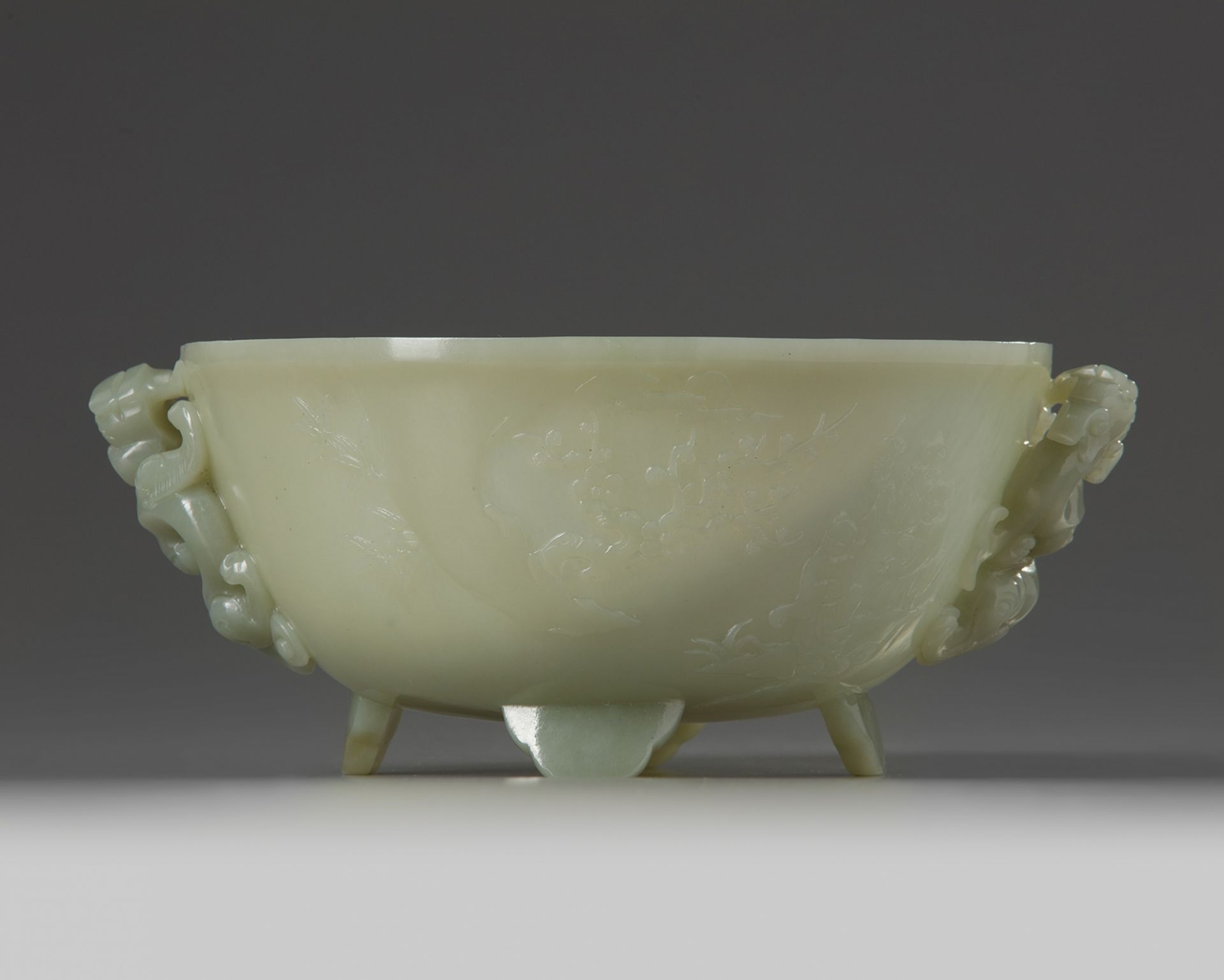 A Chinese celadon jade 'poetic' twin-handled bowl