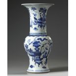 A Chinese blue and white 'precious objects' phoenix tail vase