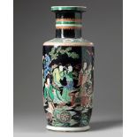 A Chinese famille noir 'Magu' rouleau vase