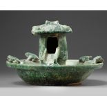 A Chinese green-glazed pottery frog pond