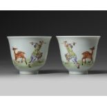 A pair of Chinese famille rose 'deer and farmer' cups