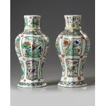 A pair of Chinese moulded famille verte vases