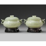 A pair of Chinese pale celadon jade censers and covers