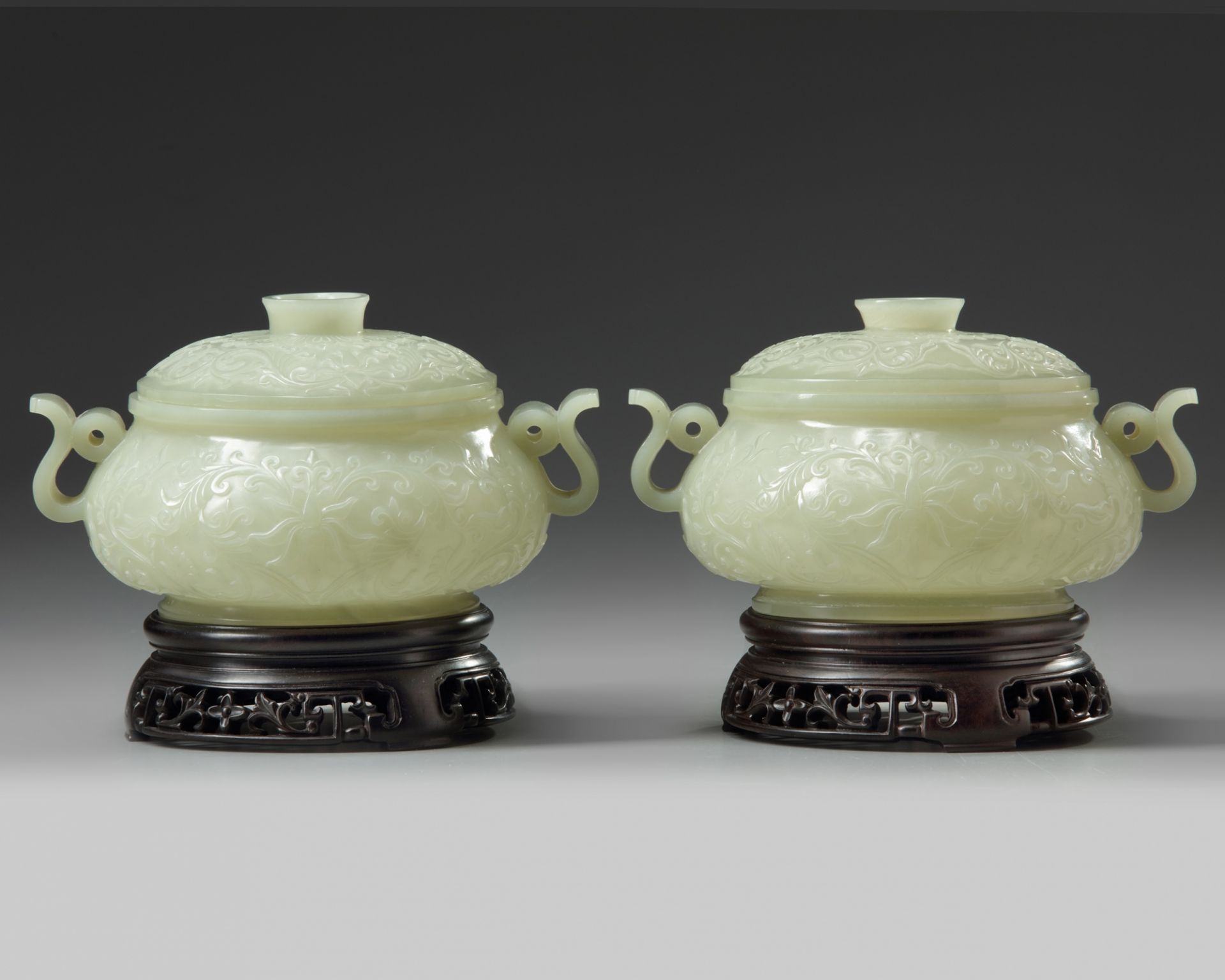 A pair of Chinese pale celadon jade censers and covers