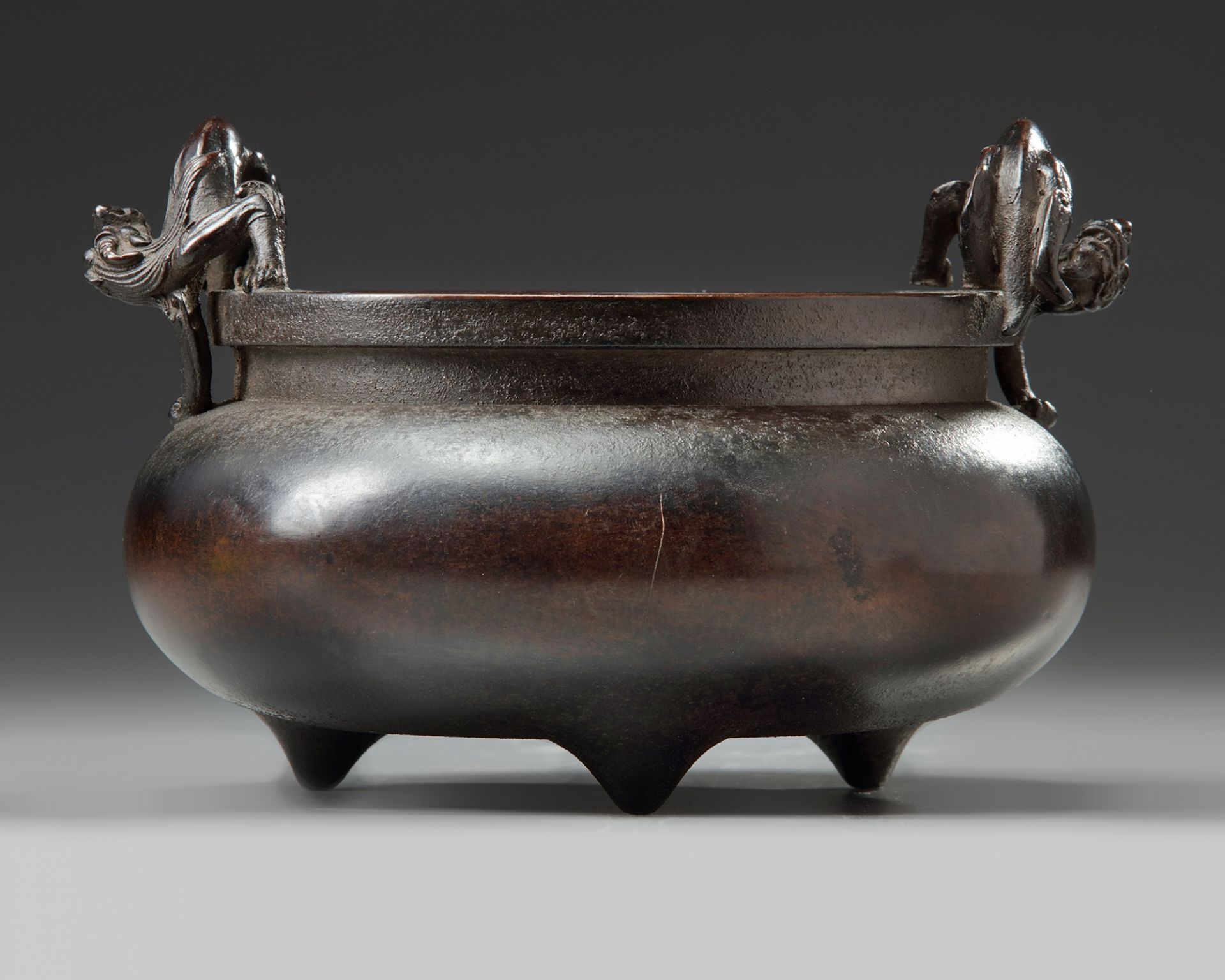 A Chinese bronze 'qilin' tripod censer