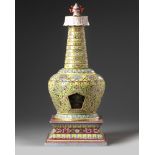 A Chinese yellow-ground famille rose stupa