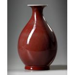 A Chinese red-glazed pear shaped vase, yuhuchunping