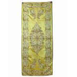 An Islamic yellow silk wrapping cloth