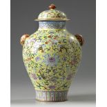 A Chinese yellow-ground famille rose 'Eight Immortals' vase and cover