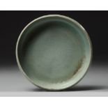 A Korean celadon-glazed 'fish and waves' washer