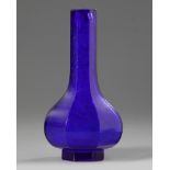 A Chinese blue glass octagonal bottle vase