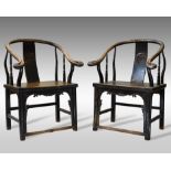 A pair of Chinese horseshoe-back armchairs