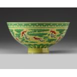 A Chinese yellow and green-enamelled 'bat' bowl with polychrome details