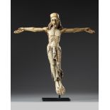 A large carved ivory figure of the crucified Christ