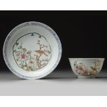 A Chinese famille rose ‘bird and flower’ cup and saucer