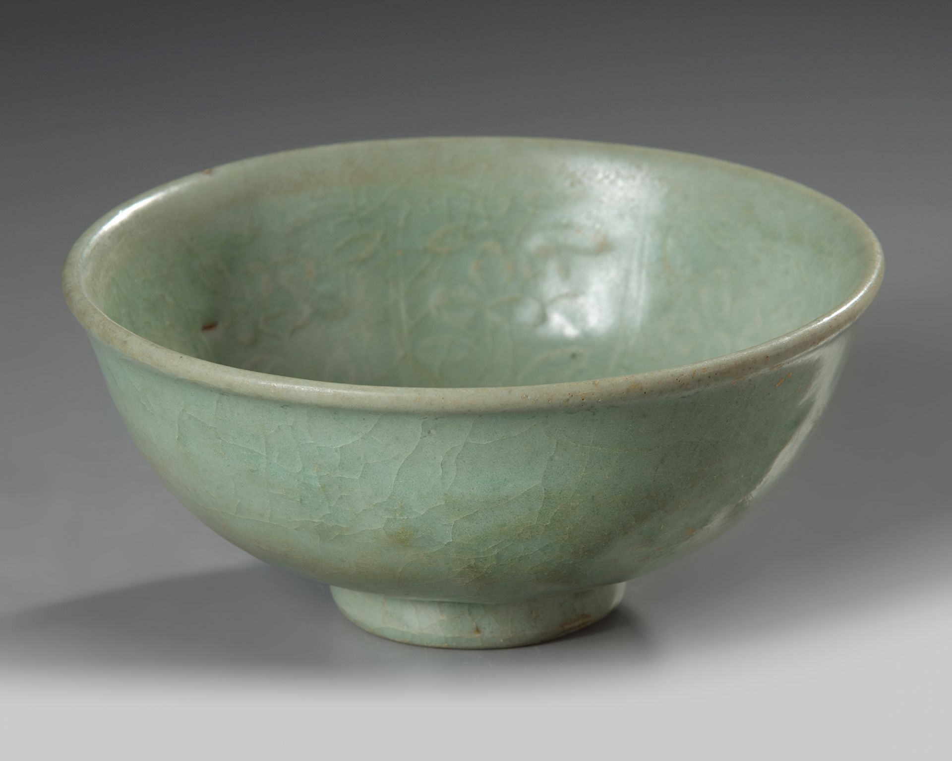 A Chinese Longquan celadon moulded ‘floral’ bowl