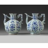 A pair of Chinese blue and white moulded octagonal wine ewers