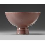 A Chinese peachbloom-glazed stem bowl