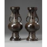 A pair of Chinese bronze vases