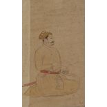 A Indian miniature depicting a seated man