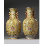 A pair of large Chinese yellow-ground famille rose vases