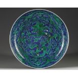 A Chinese green-enamelled blue ground 'dragon' charger