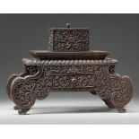 A Chinese hardwood carved 'table' box and cover