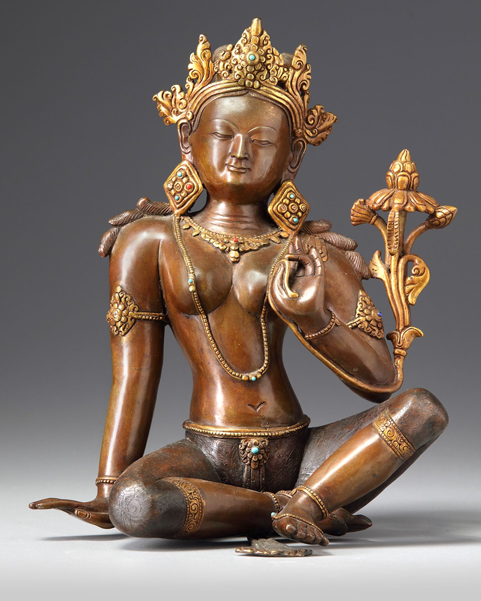 A Nepalese parcel gilt bronze figure of a bodhisattva