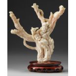 A Chinese pale coral 'figural' carving