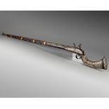 An Islamic Ottoman mother-of-pearl inlaid Miquelet gun
