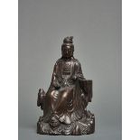 A Chinese silver-inlaid dark bronze figure of a bodhisattva Guanyin