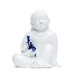 A Japanese white glazed porcelain figure of a child by Sakaida Kakiemon XII (1878–1963)