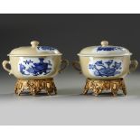 A pair of Chinese café-au-lait-ground blue and white potiches and covers