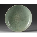 A small Chinese celadon crackle-glazed dish