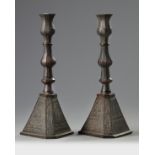 Two Persian bronze candle holders