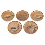 An exceptional Japanese set of five round plain hardwooden plates