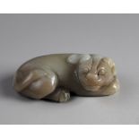 A Chinese celadon jade mythical beast