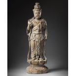 A large Chinese polychrome-decorated wood carving of Guanyin