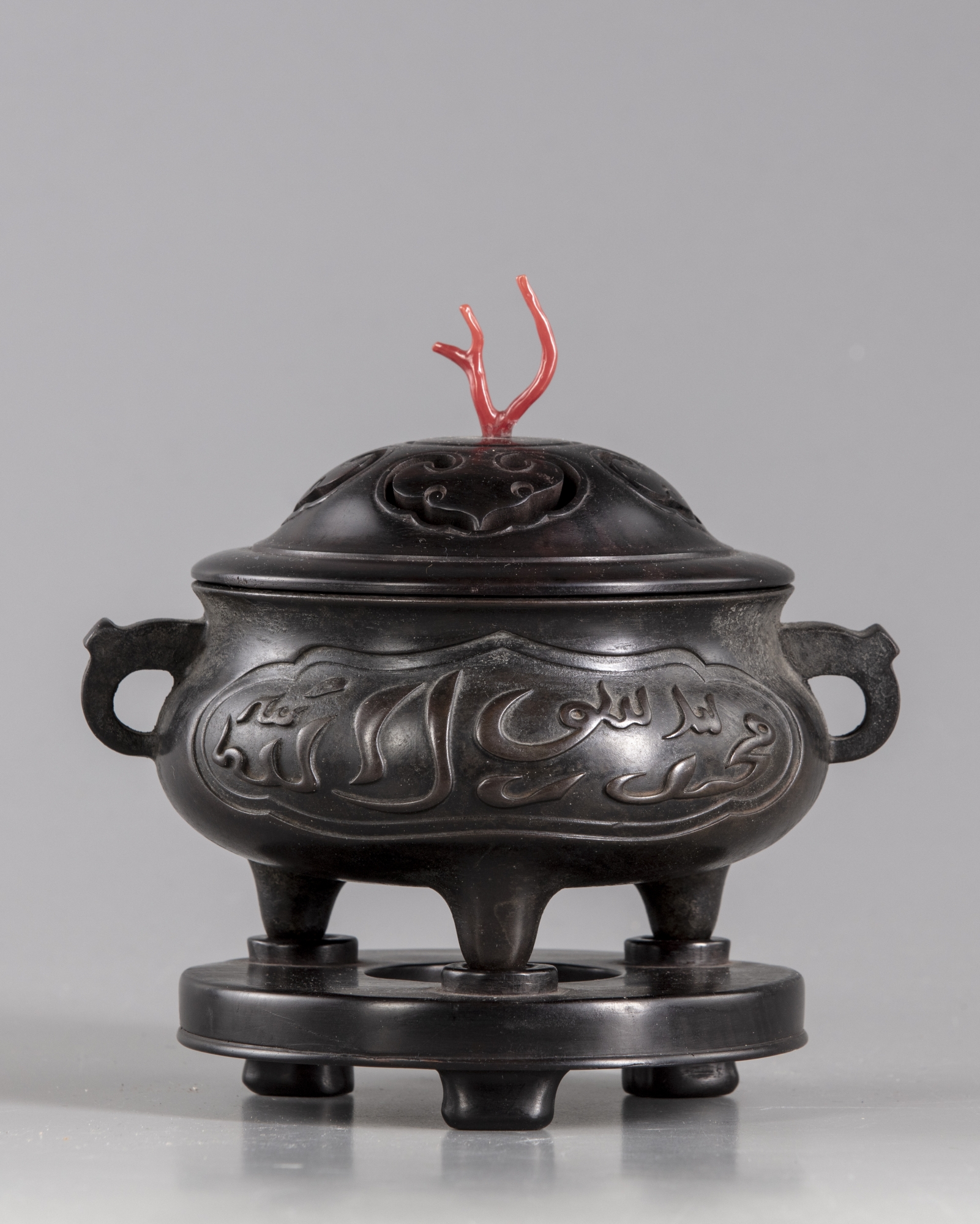 A Chinese bronze censer with wooden stand and cover