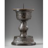 A Chinese bronze candle holder