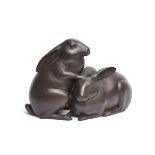 A large Japanese bronze figure of two rabbits