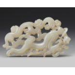 A Chinese white jade 'dragon' plaque