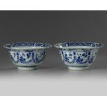 A pair of Chinese blue and white ‘floral’ klapmuts bowls