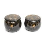A Japanese set of two black lacquered boxes containing black and white go-stones