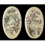 A pair of Japanese oval-shaped ivory mother-of-pearl inlaid 'cranes' plaques